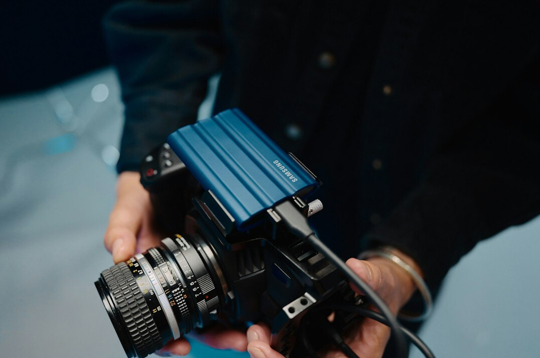 Video camera operator filming on a production set